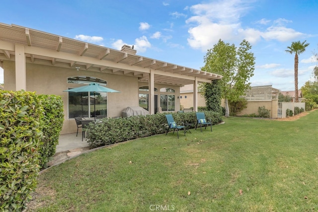 82689 Odlum Dr, Indio, CA 92201 - back of house with stucco siding, a chimney, a pergola, and a lawn