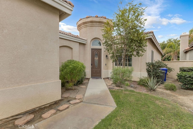 82689 Odlum Dr, Indio, CA 92201 - doorway to property featuring stucco siding and a tile roof