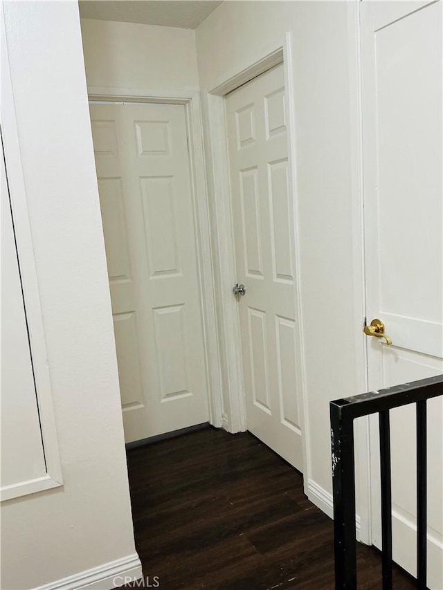 3545 20th St, Highland, CA 92346 - hall with dark wood-style flooring and baseboards