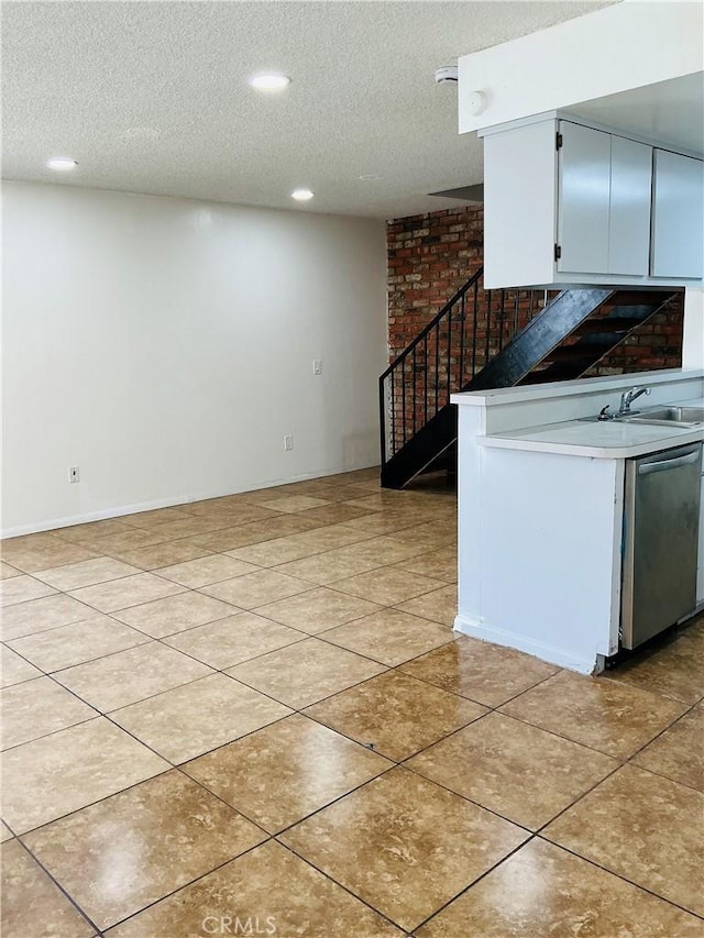 3545 20th St, Highland, CA 92346 - kitchen with a sink, stainless steel dishwasher, a textured ceiling, recessed lighting, and light tile patterned floors