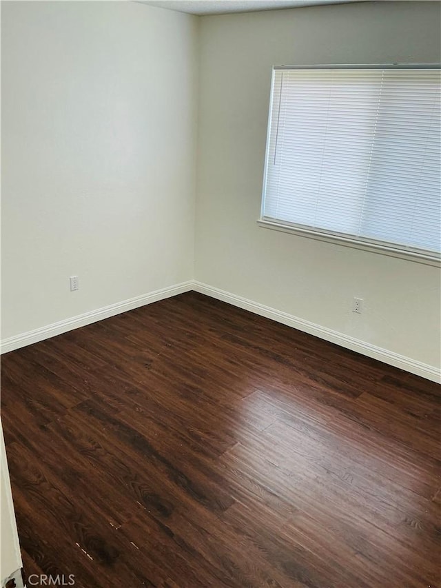 3545 20th St, Highland, CA 92346 - spare room featuring baseboards and dark wood finished floors