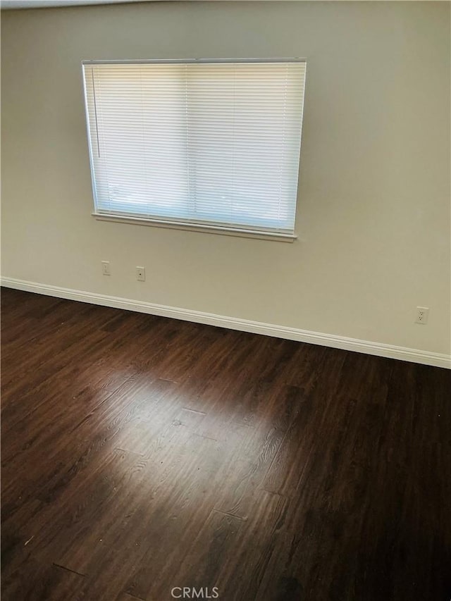 3545 20th St, Highland, CA 92346 - spare room with baseboards and dark wood finished floors