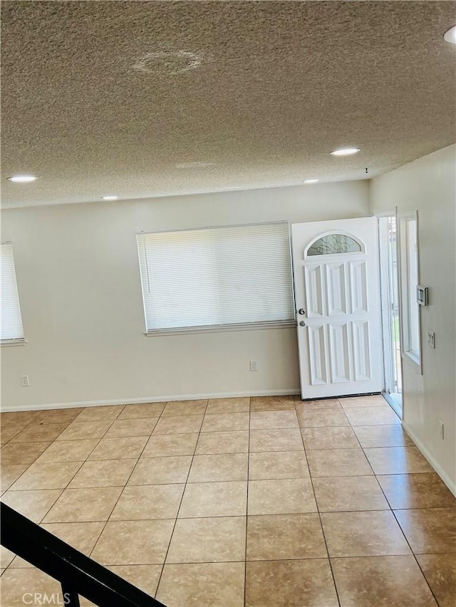3545 20th St, Highland, CA 92346 - tiled entryway featuring a textured ceiling, healthy amount of natural light, baseboards, and recessed lighting