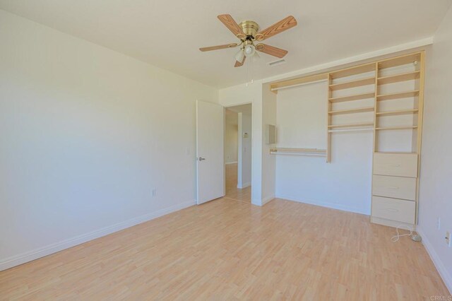 1398 Panorama Ridge Rd, Oceanside, CA 92056 - unfurnished bedroom with light wood-type flooring, a closet, and ceiling fan
