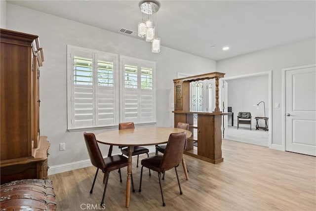 dining room with recessed lighting, light wood-type flooring, visible vents, and baseboards