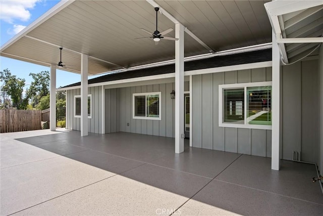 view of patio with fence and a ceiling fan