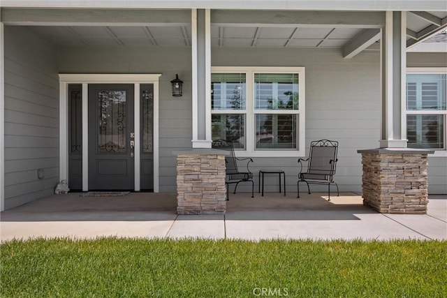 doorway to property with covered porch