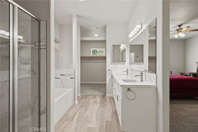 6294 W Wagstaff Rd, Paradise, CA 95969 - full bathroom featuring ceiling fan, double vanity, a stall shower, connected bathroom, and recessed lighting