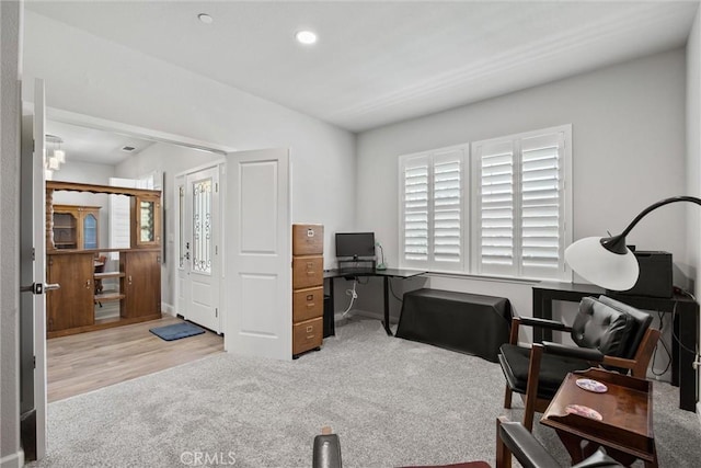 home office with recessed lighting, lofted ceiling, carpet floors, and wood finished floors