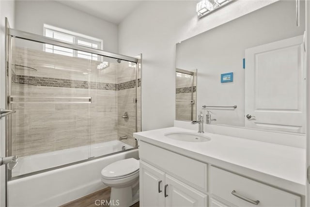 6294 W Wagstaff Rd, Paradise, CA 95969 - full bathroom with toilet, vanity, shower / bath combination with glass door, and wood finished floors