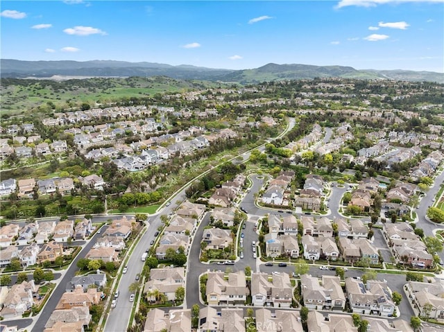 birds eye view of property with a mountain view and a residential view