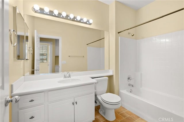 full bathroom featuring vanity, toilet, tile patterned flooring, and bathing tub / shower combination