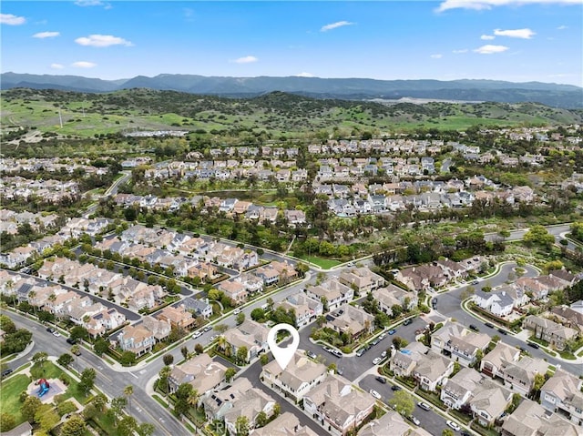 drone / aerial view featuring a mountain view and a residential view