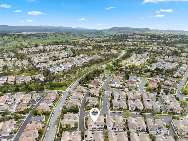 aerial view featuring a mountain view and a residential view