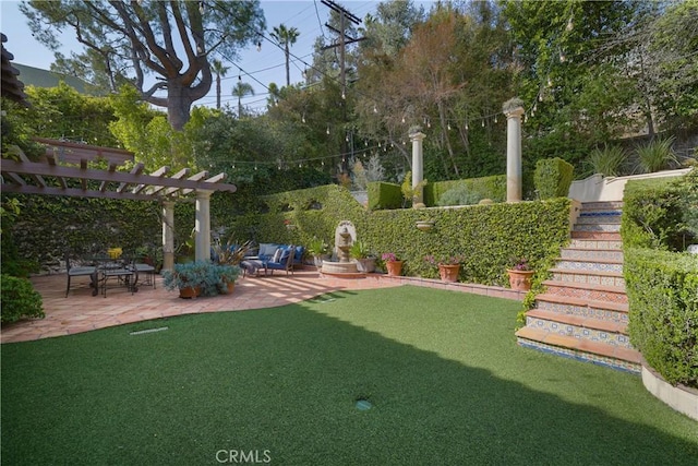 view of yard featuring stairway, a pergola, and a patio