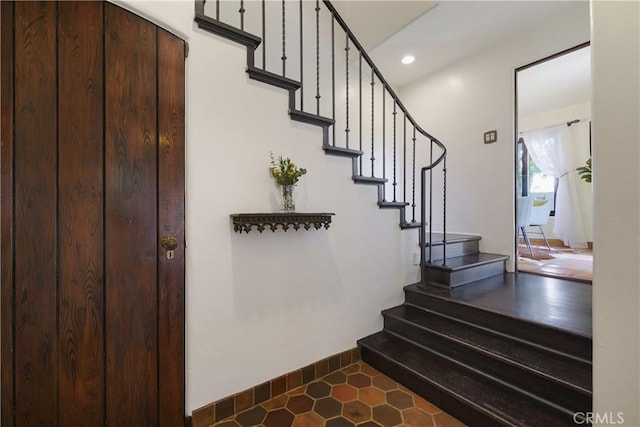 staircase with recessed lighting, tile patterned floors, and baseboards