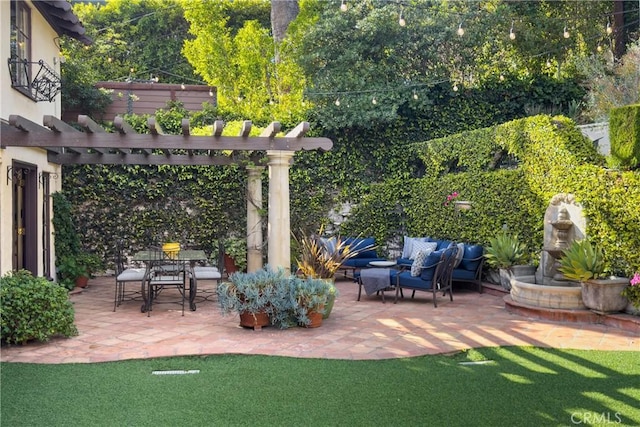view of patio featuring a pergola and an outdoor living space