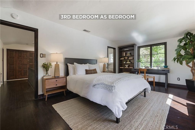 bedroom featuring vaulted ceiling, visible vents, baseboards, and dark wood-style flooring