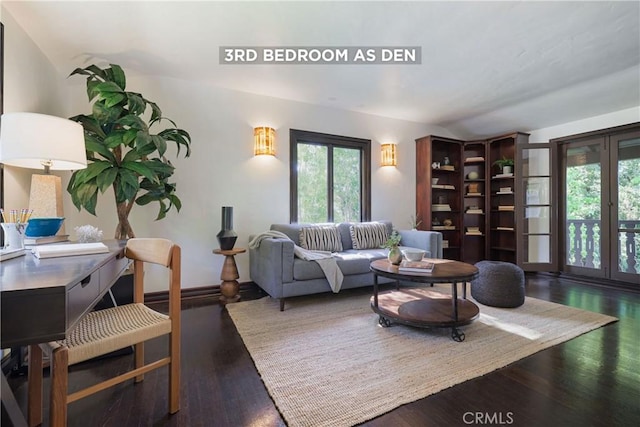 living room featuring vaulted ceiling and wood finished floors