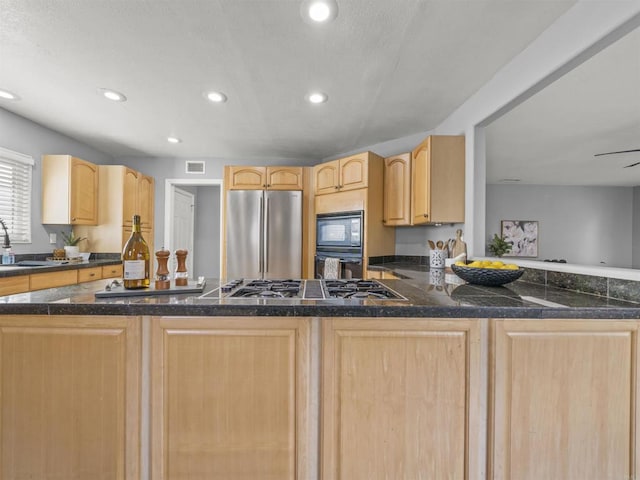 kitchen featuring a sink, visible vents, recessed lighting, light brown cabinets, and appliances with stainless steel finishes