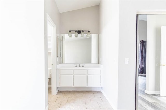 14292 Pinewood Dr, Hesperia, CA 92344 - bathroom with baseboards, toilet, and vanity