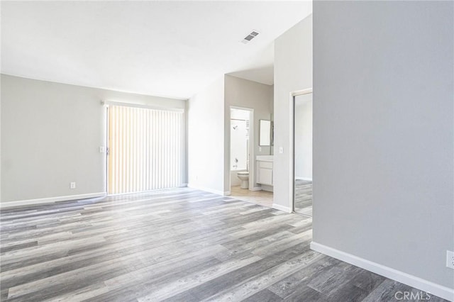 14292 Pinewood Dr, Hesperia, CA 92344 - interior space with baseboards, wood finished floors, and visible vents