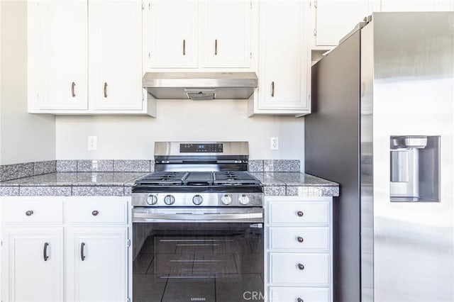14292 Pinewood Dr, Hesperia, CA 92344 - kitchen with tile counters, white cabinetry, appliances with stainless steel finishes, and under cabinet range hood