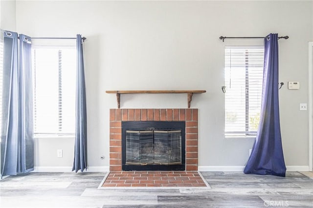 14292 Pinewood Dr, Hesperia, CA 92344 - details featuring wood finished floors, a brick fireplace, and baseboards
