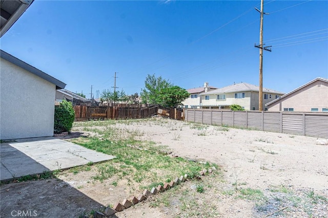 14292 Pinewood Dr, Hesperia, CA 92344 - view of yard featuring a patio and a fenced backyard