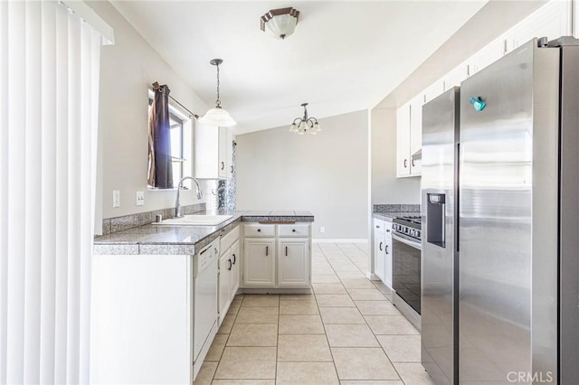 14292 Pinewood Dr, Hesperia, CA 92344 - kitchen with stainless steel appliances, a sink, a notable chandelier, white cabinetry, and tile counters
