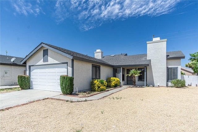 14292 Pinewood Dr, Hesperia, CA 92344 - ranch-style house featuring a chimney, concrete driveway, fence, an attached garage, and stucco siding