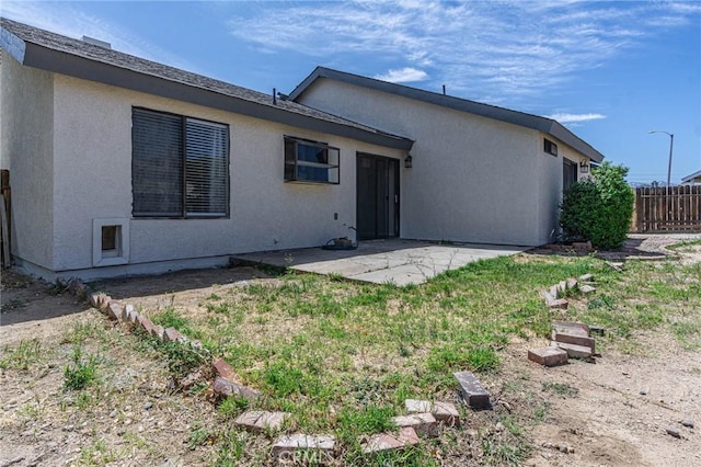 14292 Pinewood Dr, Hesperia, CA 92344 - rear view of house featuring stucco siding, fence, and a patio