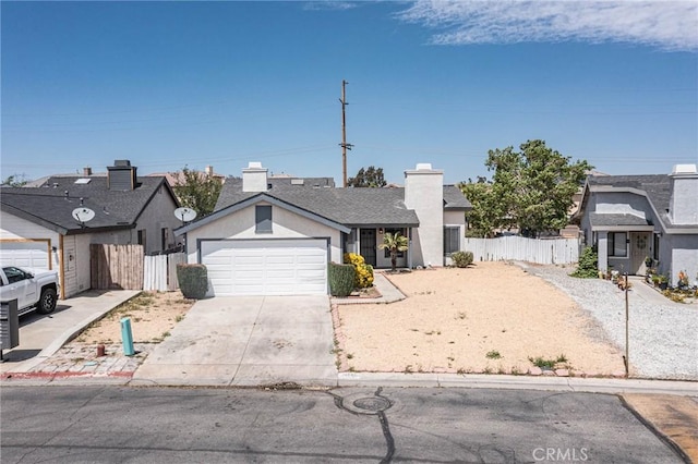 14292 Pinewood Dr, Hesperia, CA 92344 - view of front of house featuring a chimney, driveway, fence, and a garage