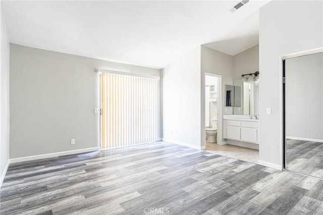14292 Pinewood Dr, Hesperia, CA 92344 - unfurnished bedroom with light wood-style floors, baseboards, visible vents, and a closet