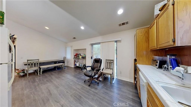 interior space featuring baseboards, recessed lighting, wood finished floors, and visible vents