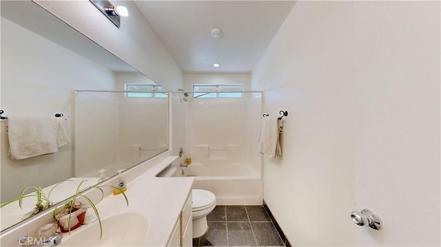 bathroom with vanity, tub / shower combination, toilet, baseboards, and tile patterned floors