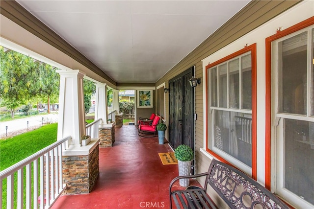 view of patio featuring a porch