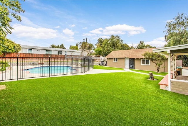 view of swimming pool with a fenced in pool, a patio area, fence, and a yard