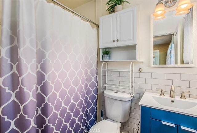 bathroom featuring vanity, toilet, tile walls, curtained shower, and tasteful backsplash