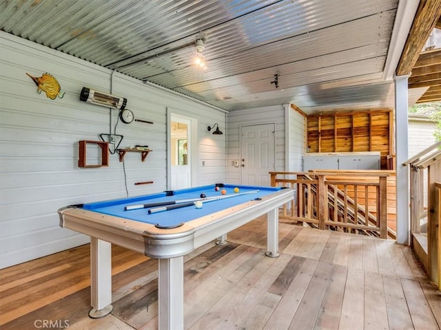 recreation room featuring wood walls, billiards, and light wood-style floors