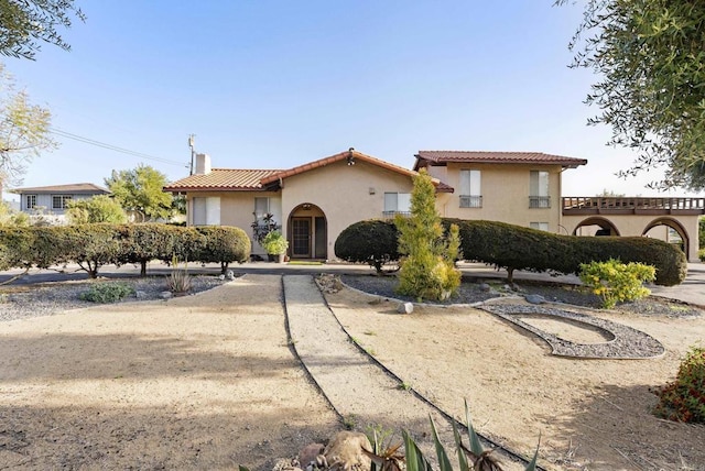 2409 Dehesa Rd, El Cajon, CA 92019 - mediterranean / spanish-style house featuring a chimney, stucco siding, and a tiled roof
