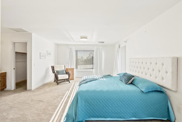 2409 Dehesa Rd, El Cajon, CA 92019 - bedroom featuring visible vents, a spacious closet, baseboards, and light carpet