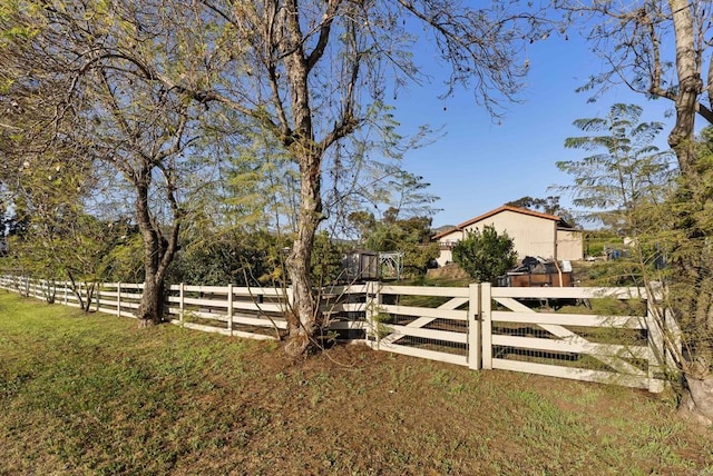 2409 Dehesa Rd, El Cajon, CA 92019 - view of gate featuring fence and a lawn