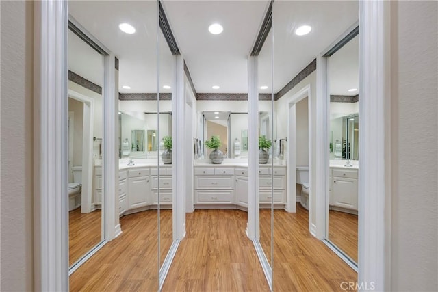 full bath featuring wood finished floors, toilet, and vanity
