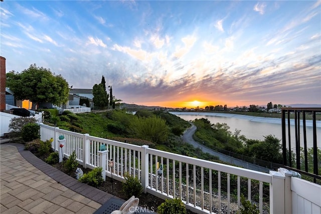 balcony at dusk with a water view