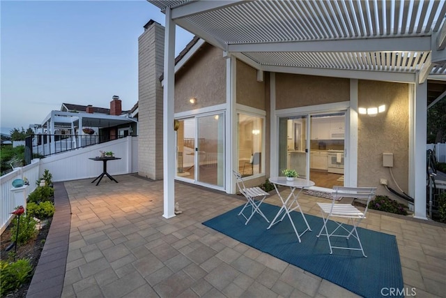 view of patio featuring fence