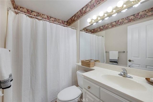 full bath featuring toilet and vanity