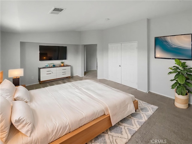 bedroom with baseboards, visible vents, and a closet