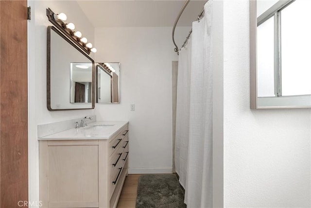 2650 Main St Unit 3, Cambria, CA 93428 - full bath with vanity, wood finished floors, and a shower with shower curtain
