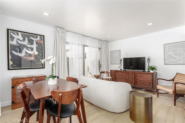 dining room featuring recessed lighting and light wood-style flooring